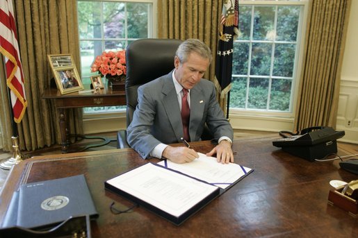 george w bush house. President George W. Bush signs